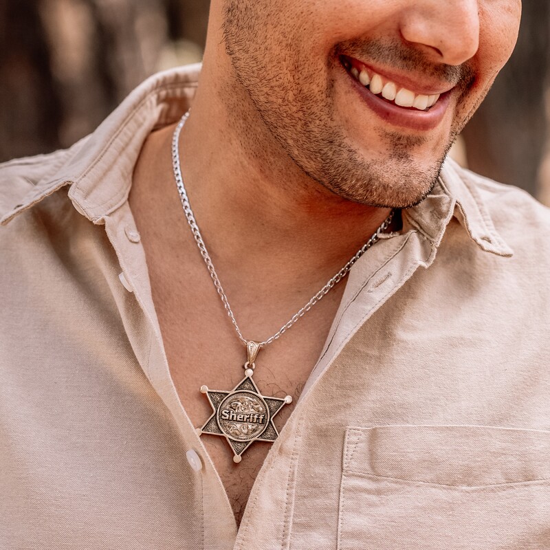 Man wearing a sheriff badge custom pendant with personalized name